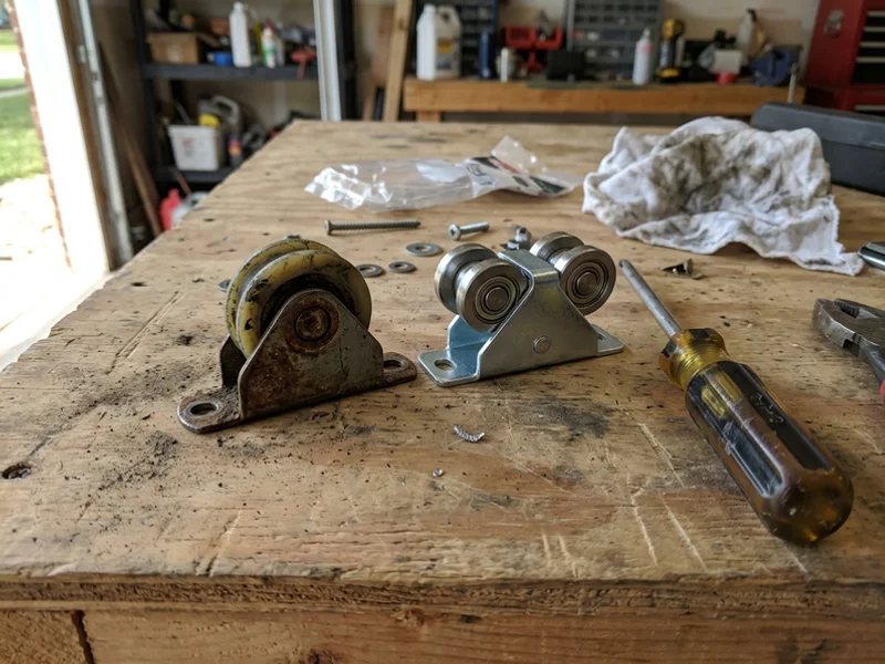 Worn nylon roller beside a new steel tandem roller