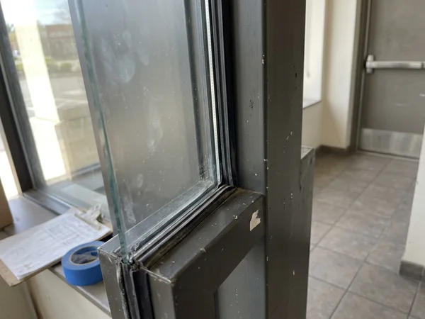 Pyrostop fire-rated glass installed in a storefront beside an exit corridor
