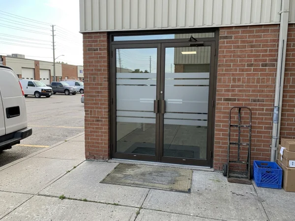 Commercial entry doors with SentryGlas glass and AODA strips in Woodbridge