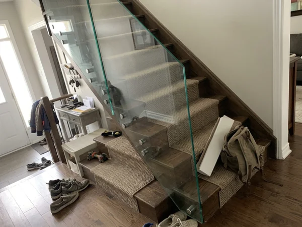 Frameless tempered glass stair railing in an Oak Ridges home