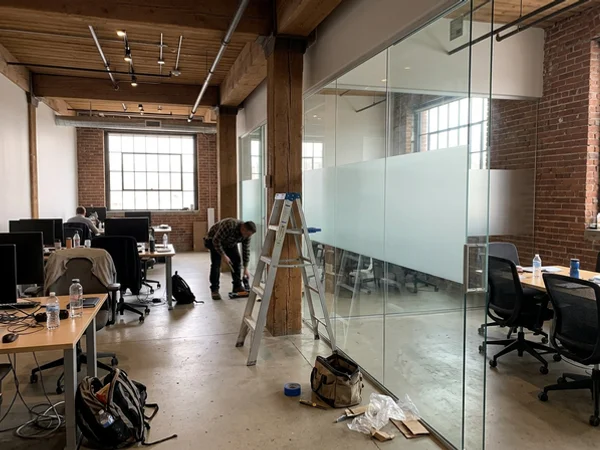 Glass boardroom wall with frosted band in a Liberty Village office