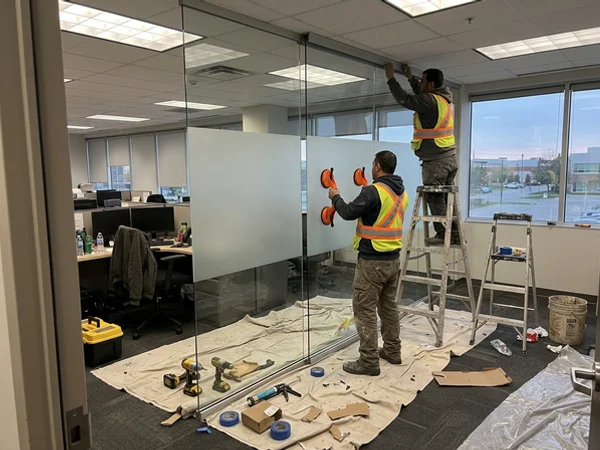 Partition wall being installed after hours in a Markham office