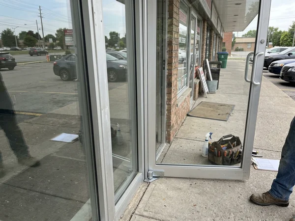 Plaza storefront entrance door with a new pivot and aligned gap