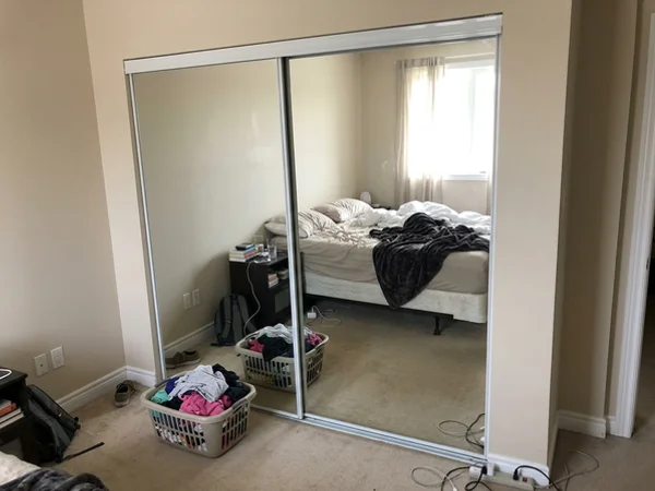 Mirrored wardrobe doors with new safety-backed panels in Unionville