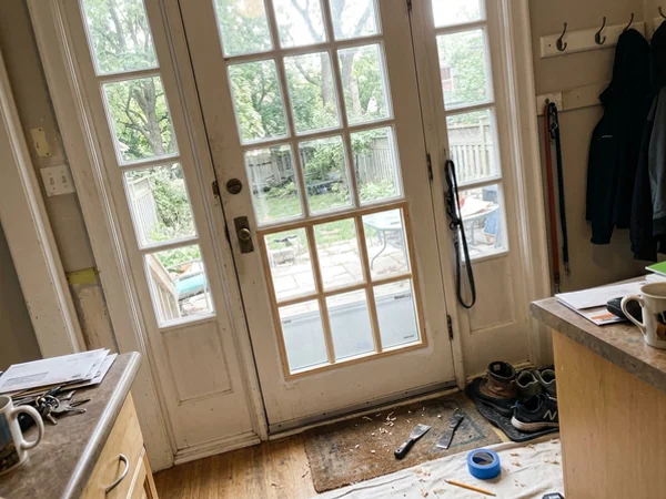 Wood French door with a new tempered lite in Guildwood