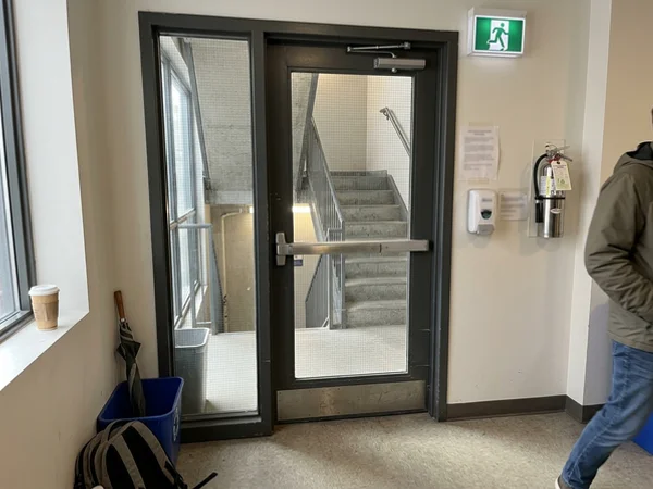 Pyrostop fire-rated glass door leading to a stairwell