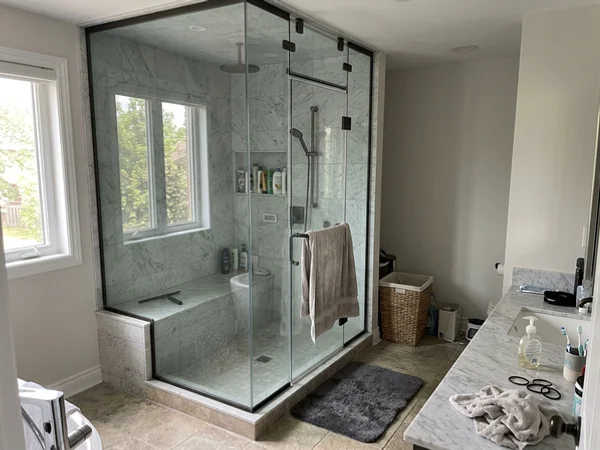 Starphire steam shower with transom in a Mill Pond bathroom